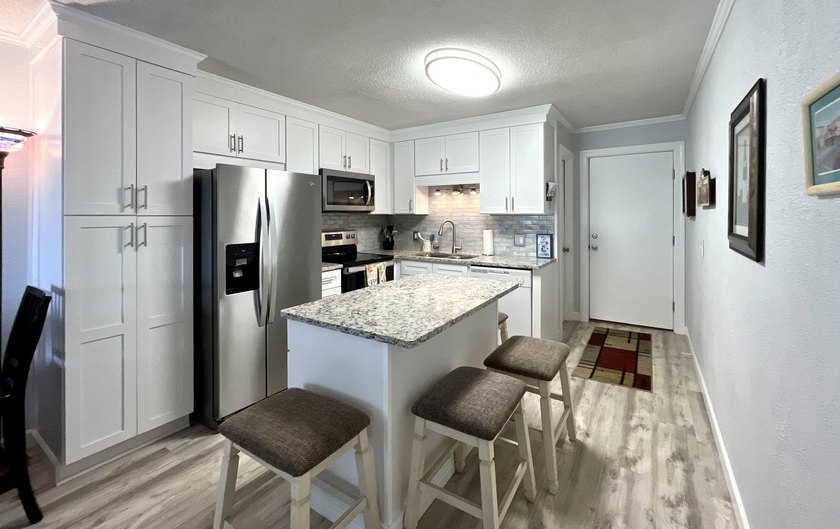 Wake up to ocean views in this beautifully updated 2BR/2BA condo - photo 7