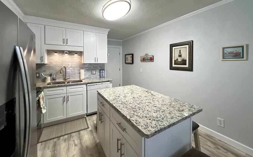 Wake up to ocean views in this beautifully updated 2BR/2BA condo - photo 9