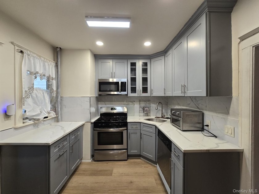 Welcome to 889 E. 37th Street, an updated single-family home - photo 4