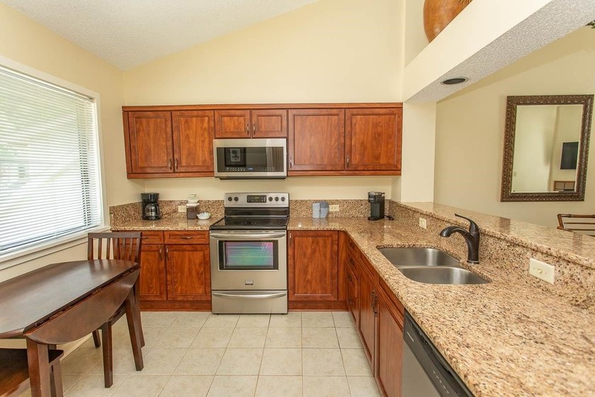 This stunning two-bedroom, two-bath, second floor villa offers - photo 5