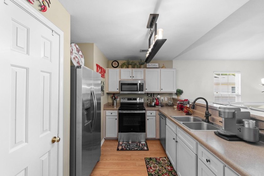 This top-floor 3-bedroom condo has the kind of charm and warmth - photo 6