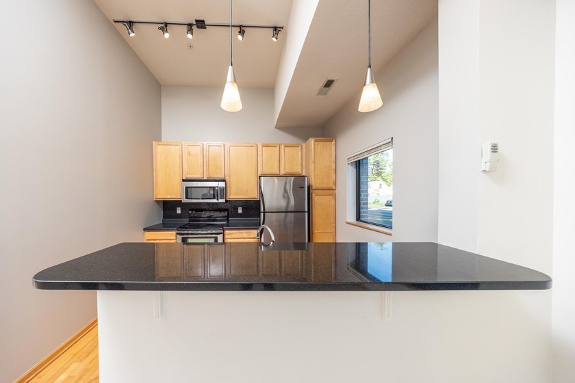 This beautiful condo is a standout with its soaring 16-foot - photo 3