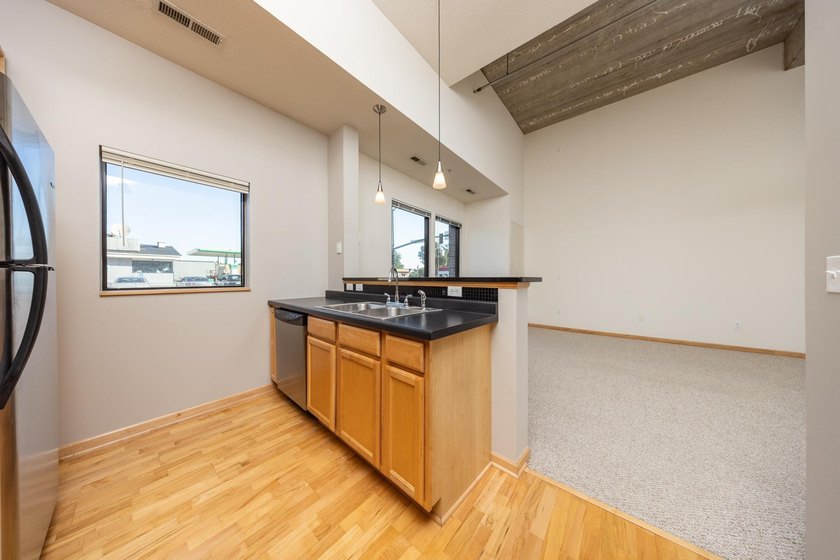This beautiful condo is a standout with its soaring 16-foot - photo 5