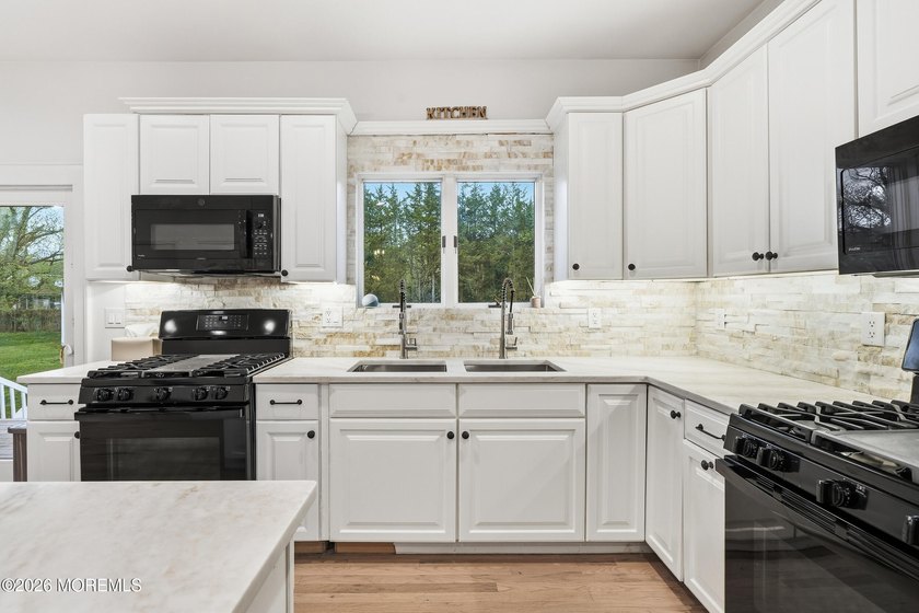 This one is a STUNNER! Set on over an acre of private property - photo 31