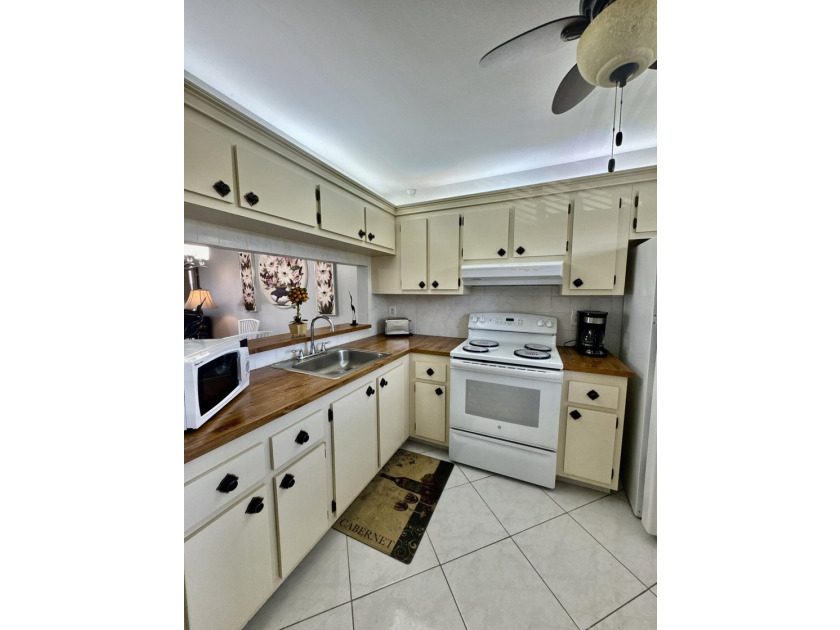 Welcome home to your well-maintained 2BR/2BA condo just steps - photo 7