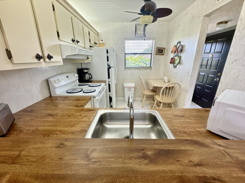 Welcome home to your well-maintained 2BR/2BA condo just steps - photo 9