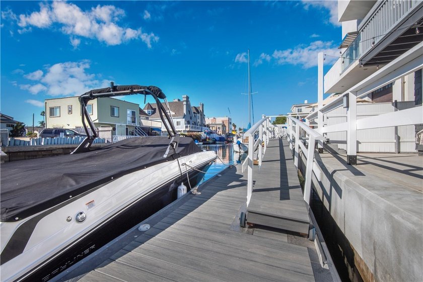 This stunning three-level waterfront home on Sunset Island - photo 25