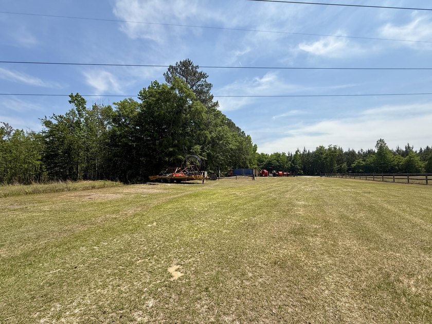 Set on 32.69 scenic acres, this charming log home offers a - photo 2
