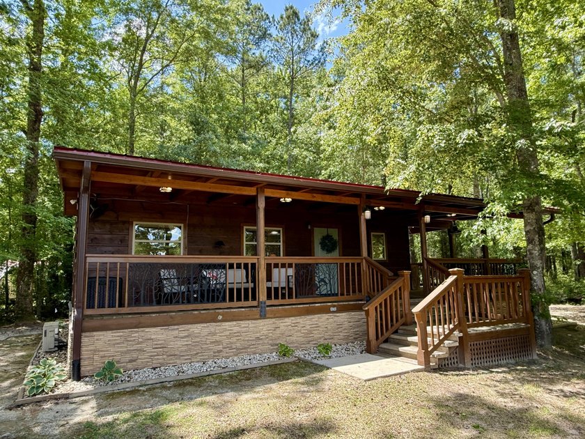 Set on 32.69 scenic acres, this charming log home offers a - photo 5