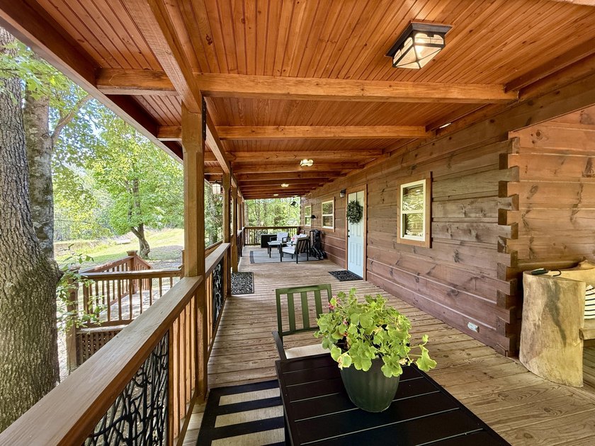 Set on 32.69 scenic acres, this charming log home offers a - photo 7