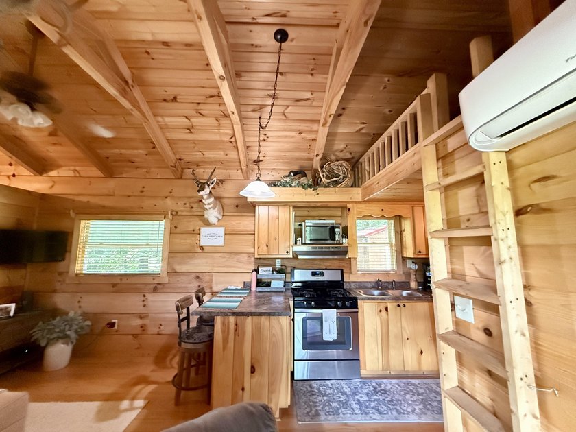 Set on 32.69 scenic acres, this charming log home offers a - photo 10