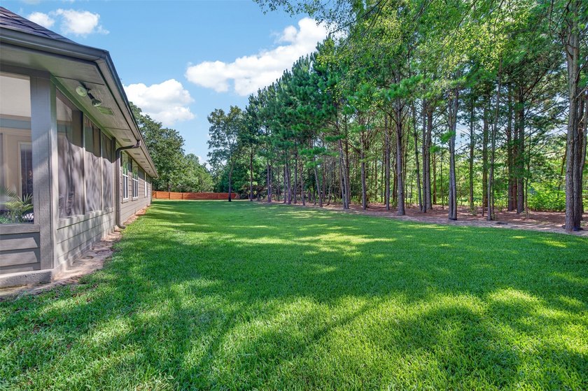 Located on three premium wooded lots in the gated community of - photo 32