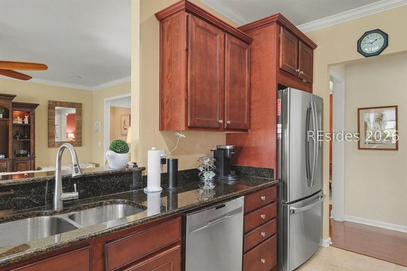 Set on a large premium lot with peaceful lagoon views, timeless - photo 15