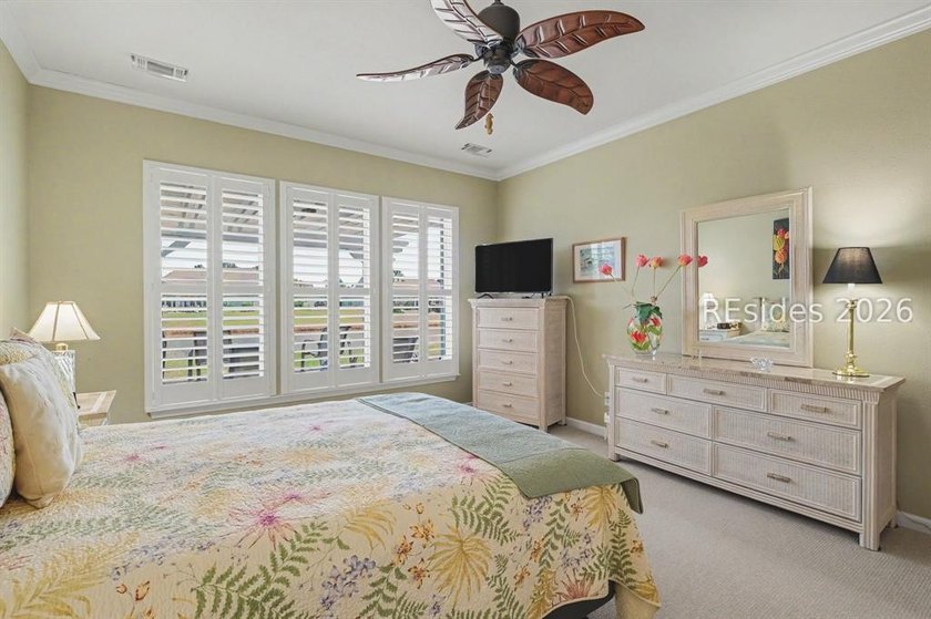 Set on a large premium lot with peaceful lagoon views, timeless - photo 17