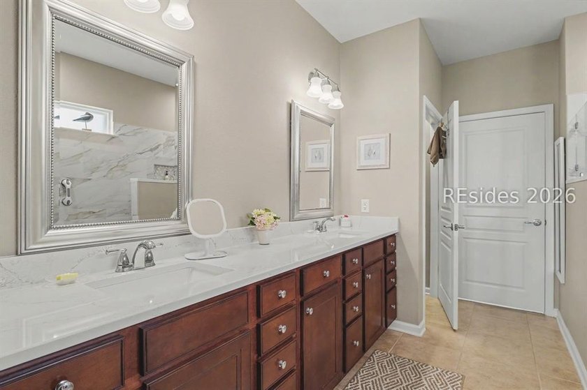 Set on a large premium lot with peaceful lagoon views, timeless - photo 19
