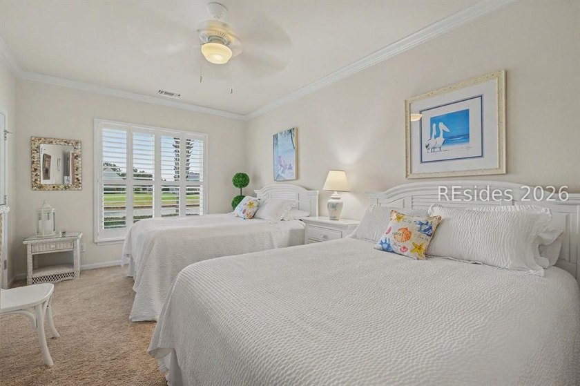 Set on a large premium lot with peaceful lagoon views, timeless - photo 22