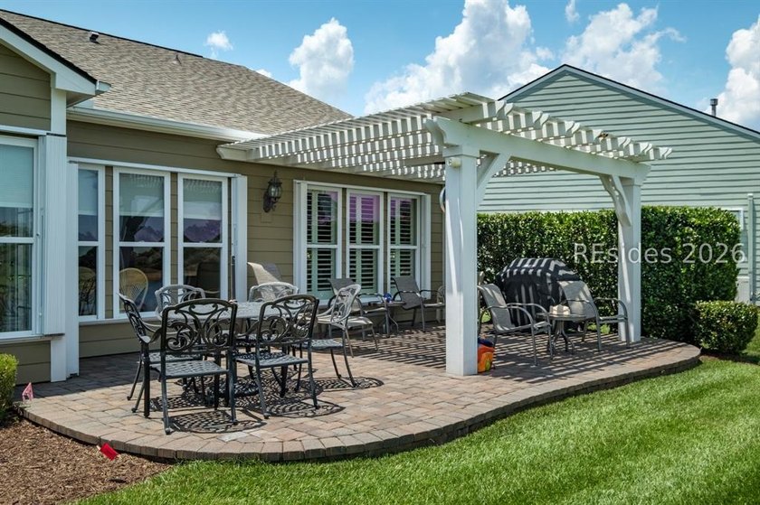 Set on a large premium lot with peaceful lagoon views, timeless - photo 29