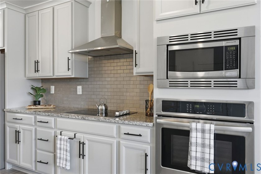 This beautifully designed two-story townhome style condo with a - photo 3