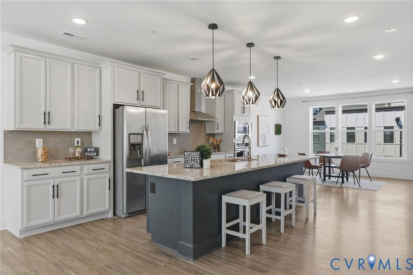 This beautifully designed two-story townhome style condo with a - photo 5