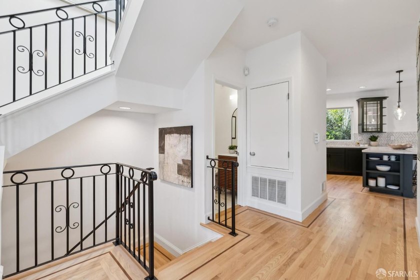 This gorgeous, light-filled home with wood floors throughout - photo 5