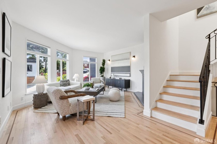 This gorgeous, light-filled home with wood floors throughout - photo 7