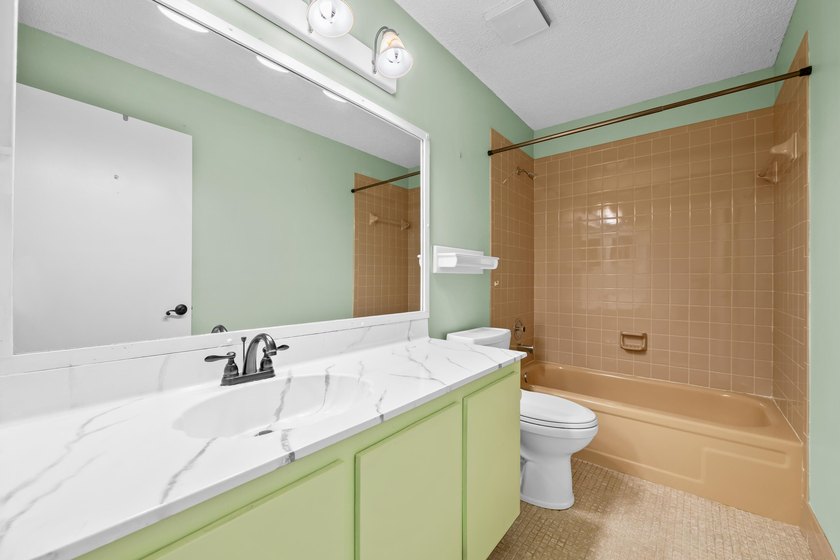 Welcome to this charming two-bedroom, two-bathroom villa in - photo 19