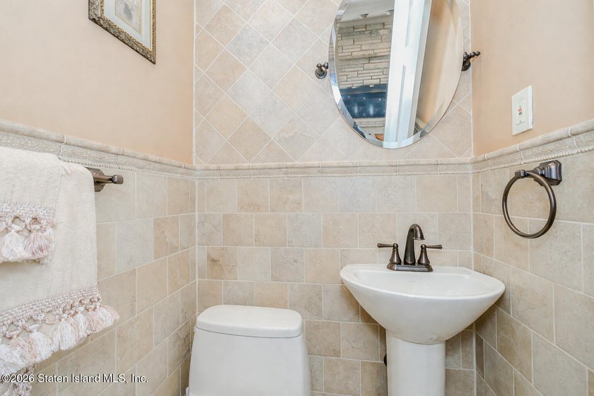 Welcome to this custom-built two-family detached home! This - photo 35
