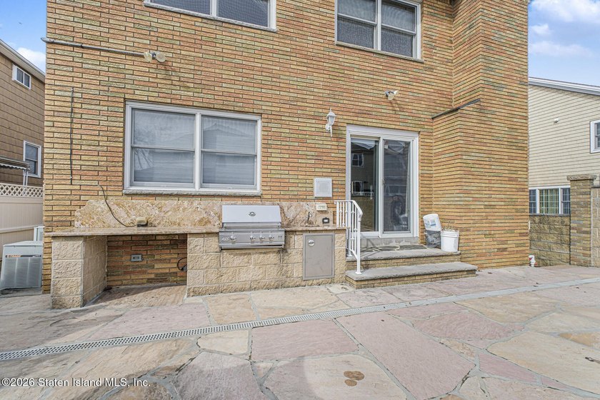 Welcome to this custom-built two-family detached home! This - photo 49