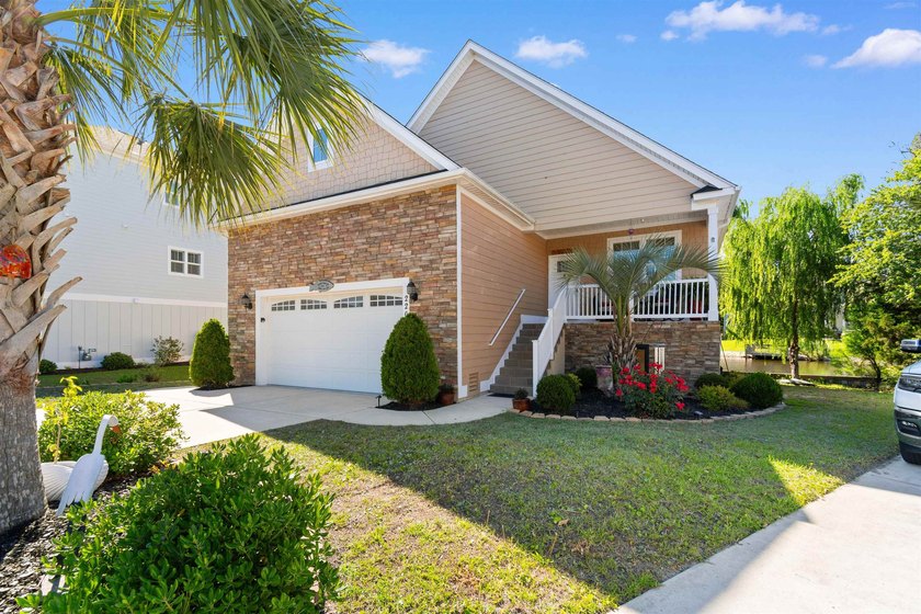 This spacious 4-bedroom, 3-bath home offers a versatile open - photo 2