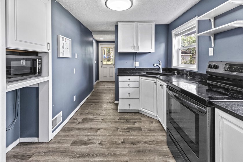 Wake up to beautiful views of Houghton Lake from the spacious - photo 17