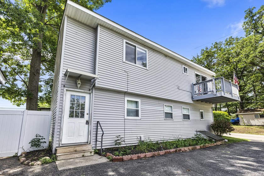 Wake up to beautiful views of Houghton Lake from the spacious - photo 31