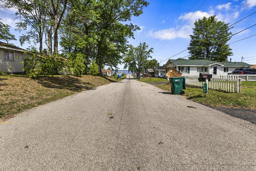 Wake up to beautiful views of Houghton Lake from the spacious - photo 37