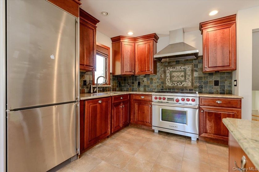 Welcome to this completely updated, modern split-level home in - photo 6