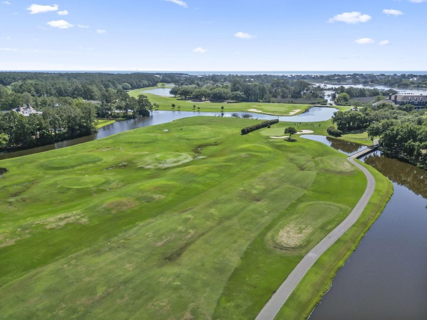 Buildable 0.51-acre pond-view homesite on Colony Club Drive in - photo 6