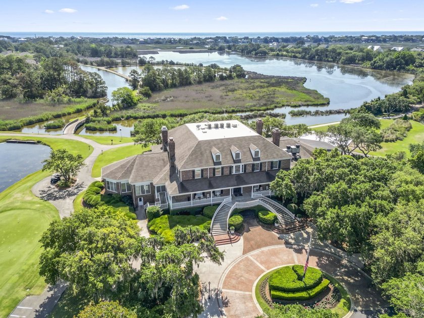 Buildable 0.51-acre pond-view homesite on Colony Club Drive in - photo 7