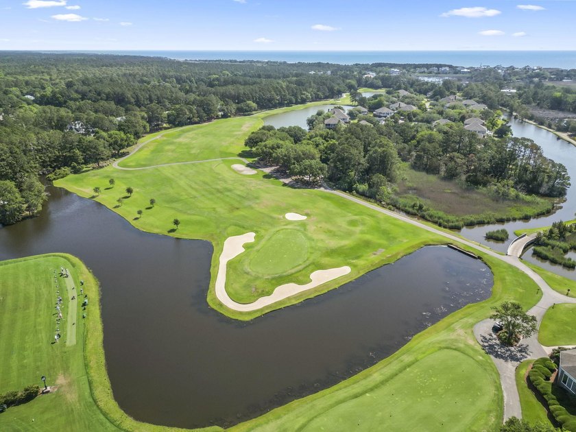 Buildable 0.51-acre pond-view homesite on Colony Club Drive in - photo 8
