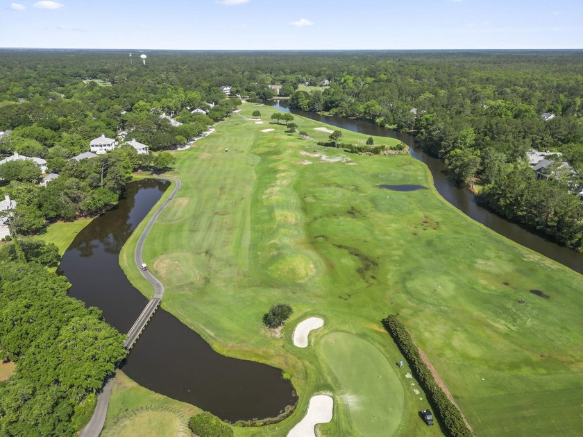 Buildable 0.51-acre pond-view homesite on Colony Club Drive in - photo 9