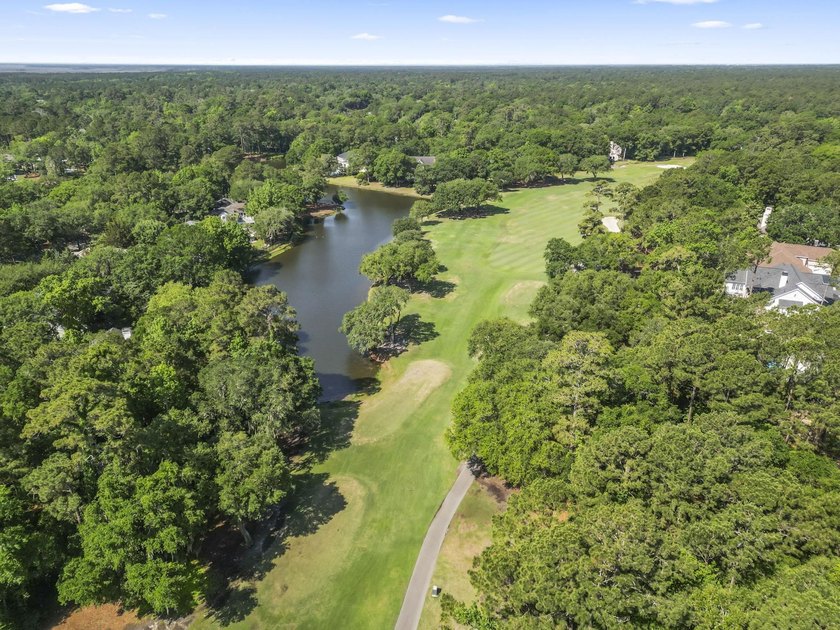 Buildable 0.51-acre pond-view homesite on Colony Club Drive in - photo 10
