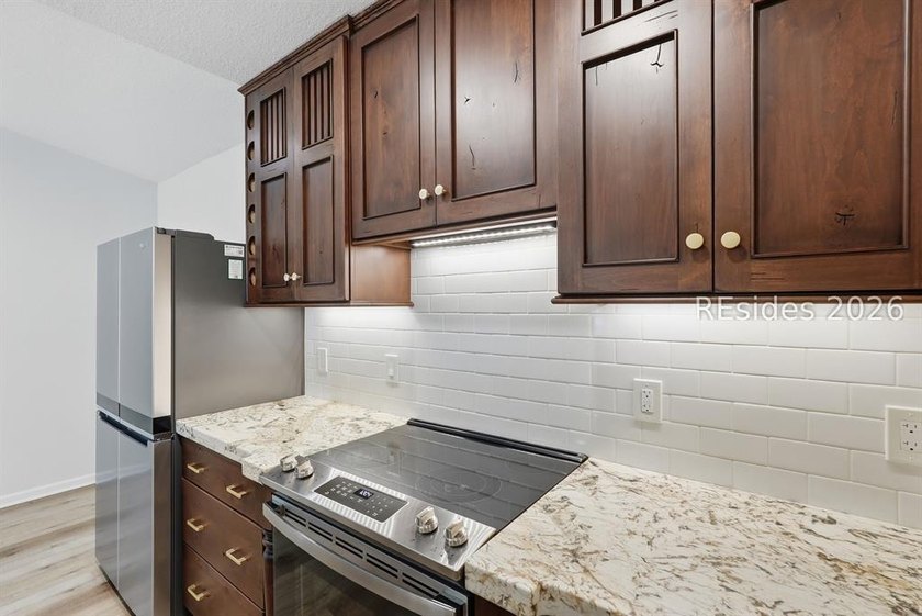 Extensively renovated in 2023, this second-floor end unit offers - photo 12