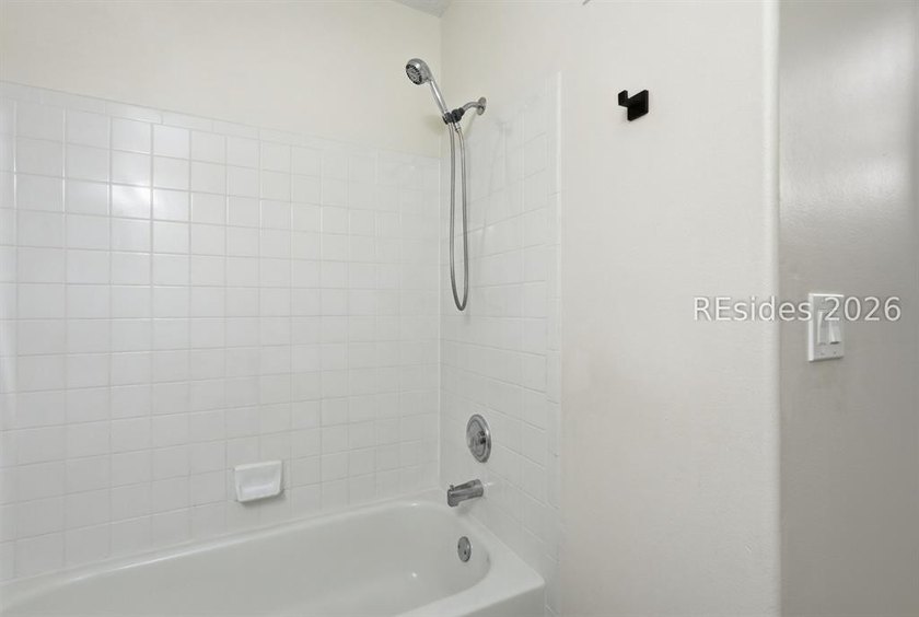 Extensively renovated in 2023, this second-floor end unit offers - photo 39