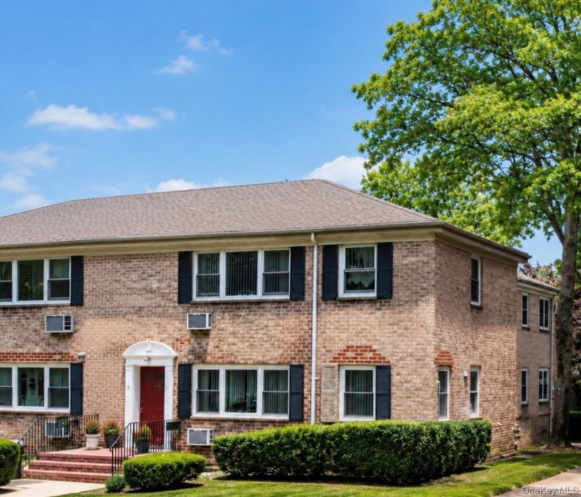 Welcome home to this sun-filled second-floor CORNER unit in a - photo 2