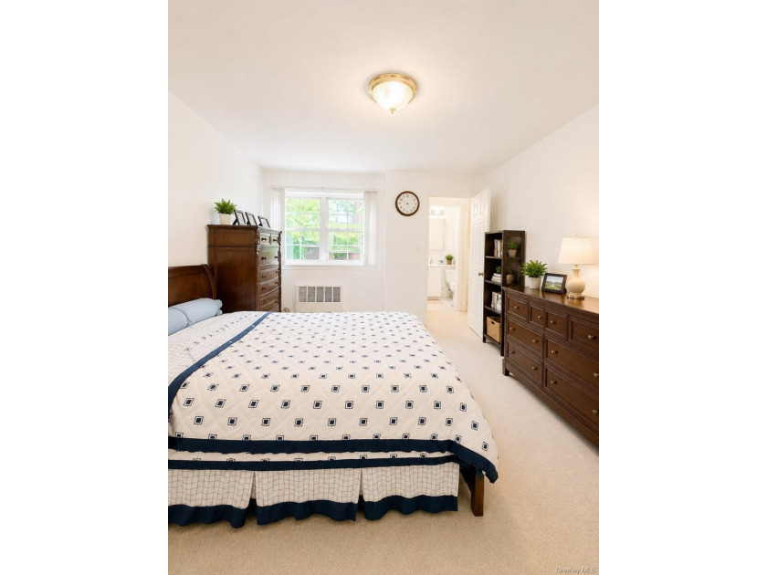 Welcome home to this sun-filled second-floor CORNER unit in a - photo 7