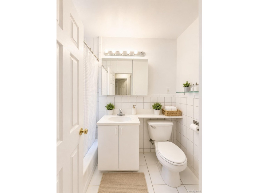 Welcome home to this sun-filled second-floor CORNER unit in a - photo 8