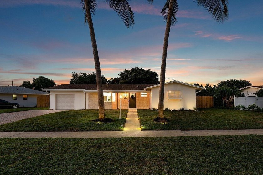 Welcome to this charming three-bedroom, two-bathroom - photo 41