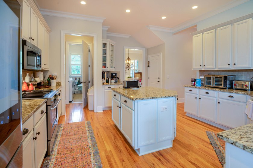 Welcome to this beautifully elevated Lowcountry-style home--the - photo 8