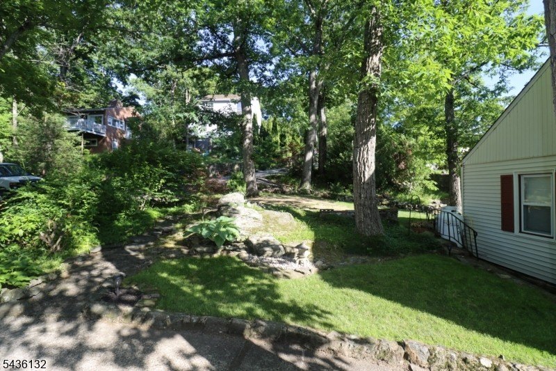 Charming custom-built Cape Cod home nestled on a prime corner - photo 26