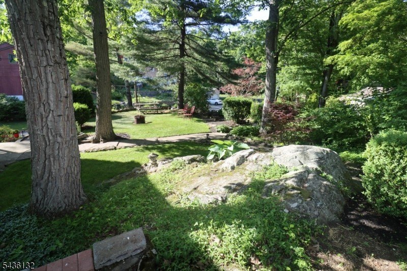 Charming custom-built Cape Cod home nestled on a prime corner - photo 28