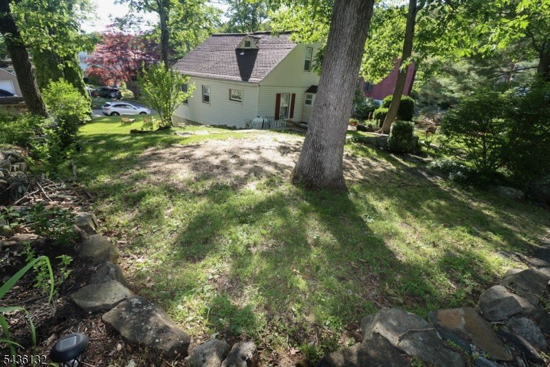 Charming custom-built Cape Cod home nestled on a prime corner - photo 29