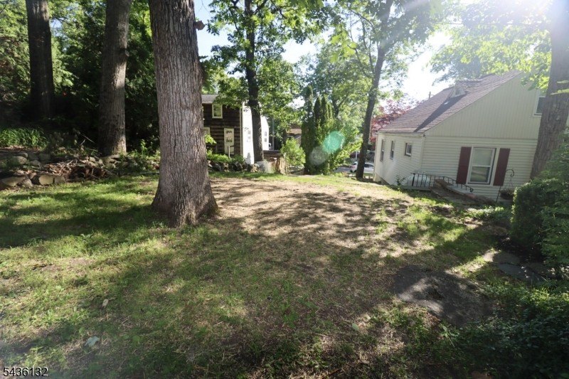 Charming custom-built Cape Cod home nestled on a prime corner - photo 31