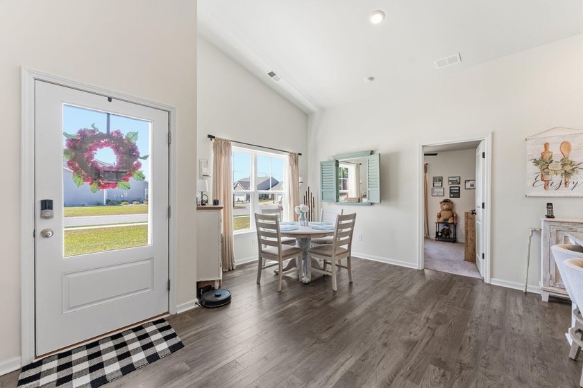 Situated in the Towns at Heather Glen community, this light and - photo 8